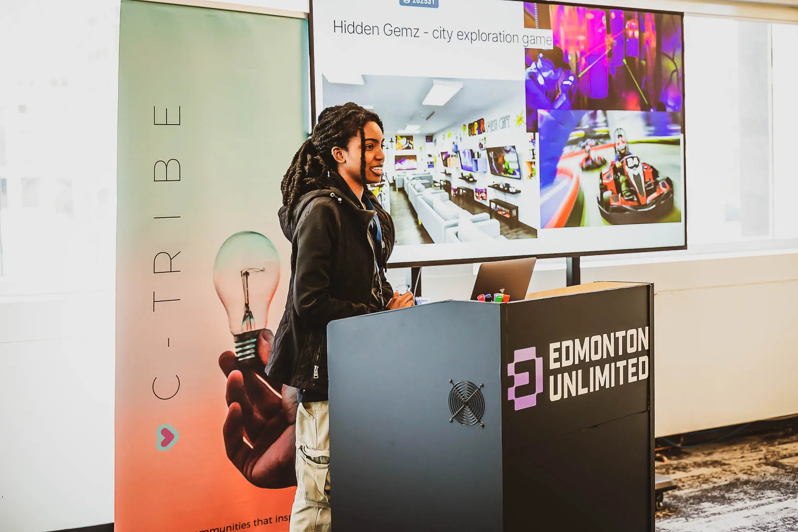 Speaker presenting at C-Tribe