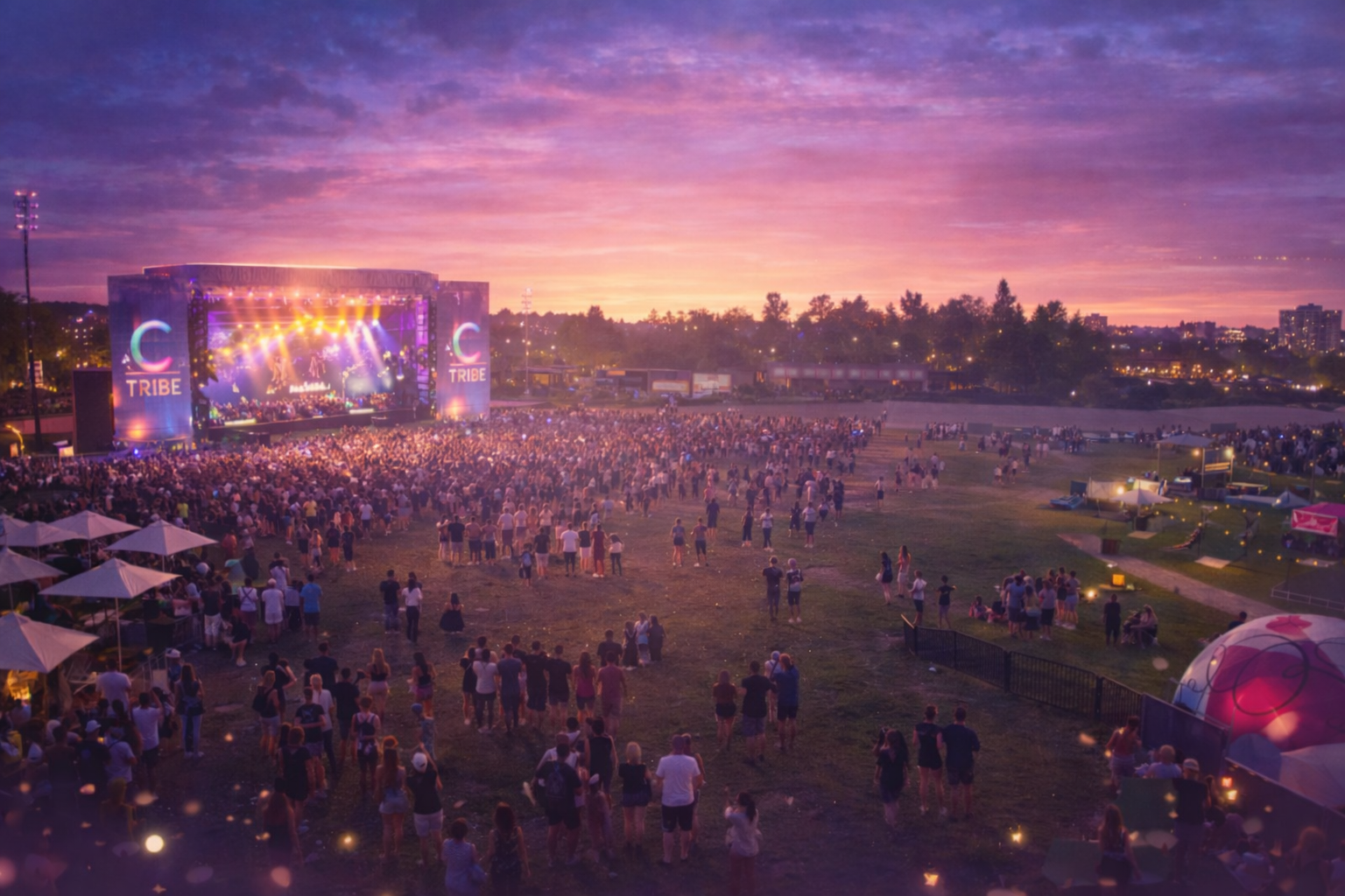 C-Tribe Festival outdoor stage with crowd at sunset